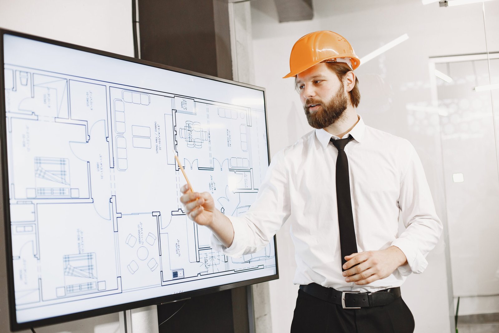 young manager in the office with helmet