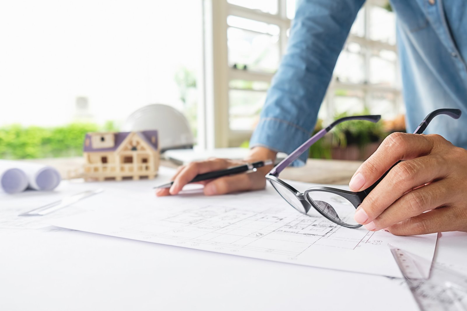 hands of engineer working on blueprint,construction concept. eng